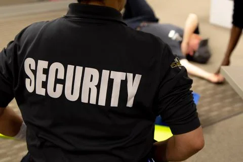 Security guards are learning how to use fire alarm panel Stock Photos