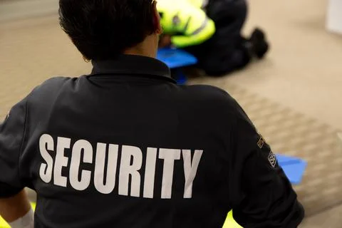 Security guards are learning how to use fire alarm panel Stock Photos