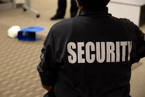 Security guards are learning how to use fire alarm panel Stockfoto's