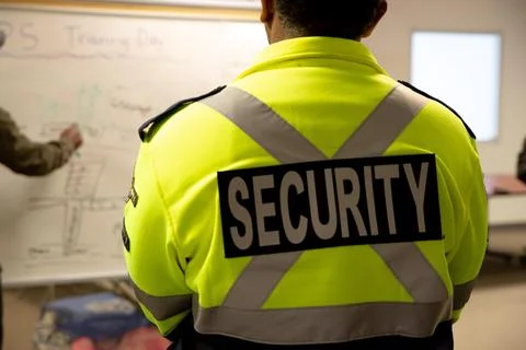 Security guards are learning how to use fire alarm panel Stock Photos
