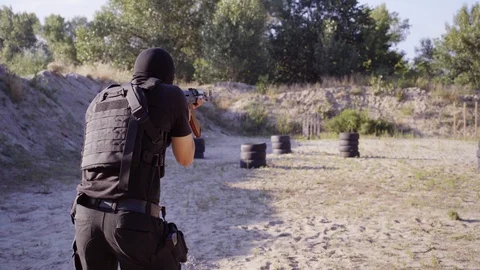 The security guards are trained to shoot guns at the shooting range. Stock Footage 95184472