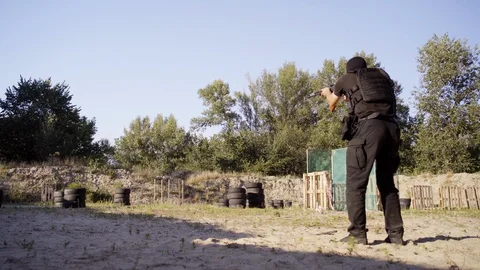 The security guards are trained to shoot guns at the shooting range. Stock Footage 95187237