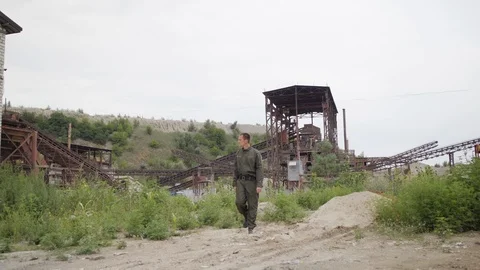Security guards in full equipment, gun, body armor, masks inspect the territory Stock Footage 95203952