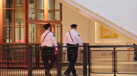 Security guards walking in the mall Stock Footage 36643583