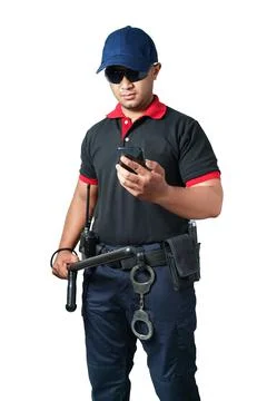 Security guards wearing black glasses and hats Standing holding a rubber bato Foto stock