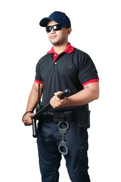Security guards wearing black glasses and hats Standing holding a rubber bato Stock Photos