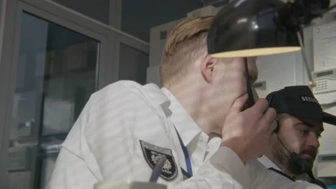 Security guards work in observation room Stock Footage 237218141