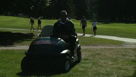 Security guy seating on a golf cart. Видео 76781237