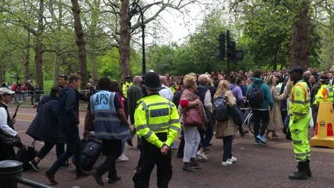 Security Helping Coronation Crowds Cross Road, London Stock Footage 240441242