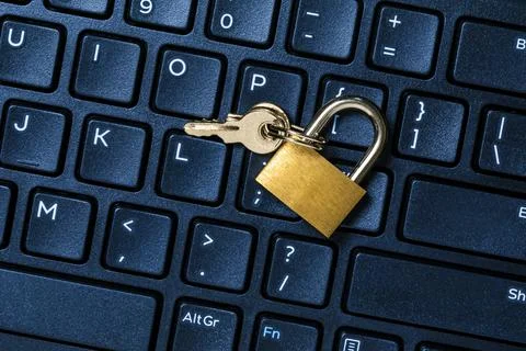 Security lock on computer keyboard Stock Photos