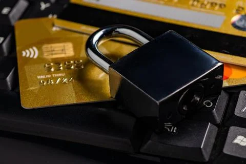 Security lock on credit cards with computer keyboard - credit card data secur Stock Photos