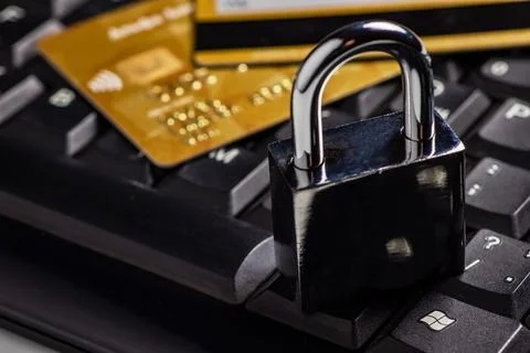 Security lock on credit cards with computer keyboard - credit card data secur Stock Photos