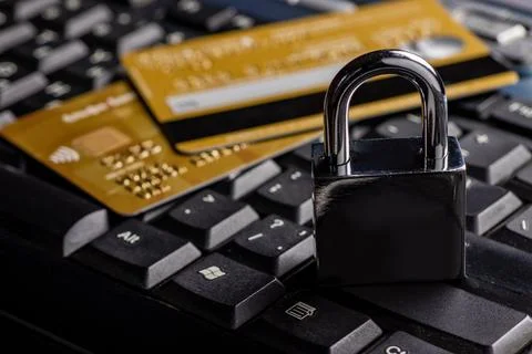 Security lock on credit cards with computer keyboard - credit card data sec.. Stock Photos