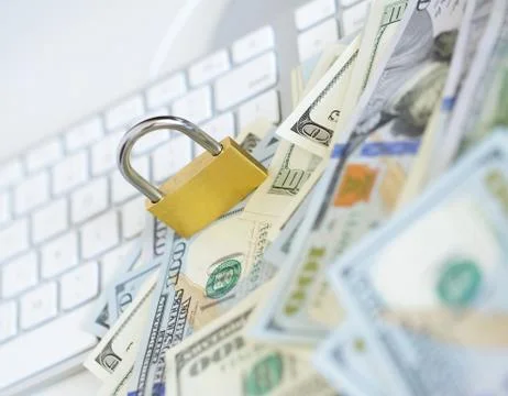 Security lock on dollar bills with white computer keyboard Stock Photos