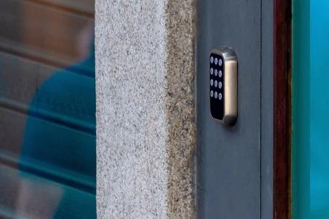 A security lock on an gate with a touch panel for access by an access code ke Stock Photos