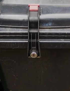 Security Lock on Trash Bin Against Illegal Waste Disposal Stock Photos