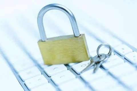 Security lock on white computer keyboard Stock Photos
