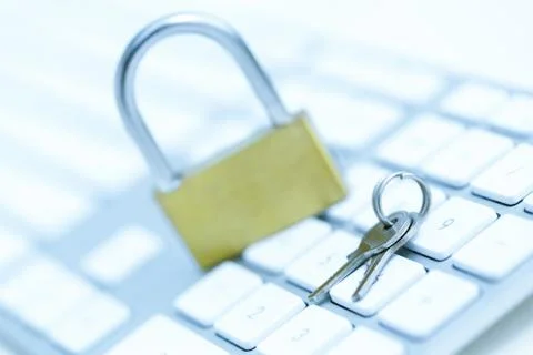 Security lock on white computer keyboard Stock Photos