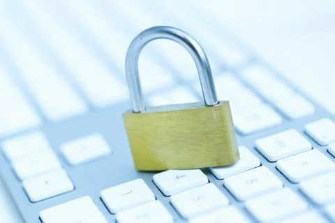 Security lock on white computer keyboard Stock Photos