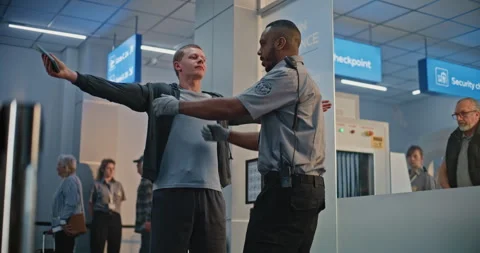 Security Officer Inspecting Young Man with Bionic Prosthetic Leg for Boarding 스톡 동영상 307376363
