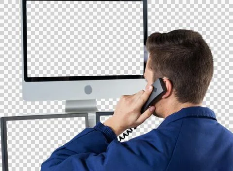 Security officer talking on telephone while looking at computer monitors Stock Photos