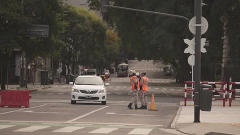Security officers requesting permits during quarantine Stock Footage 128776308
