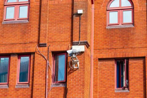 Security or cctv cameras on the side of a Police building Stock Photos
