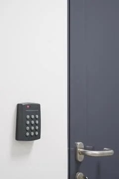 Security Panel and Door Handle on Modern Door Stock Photos