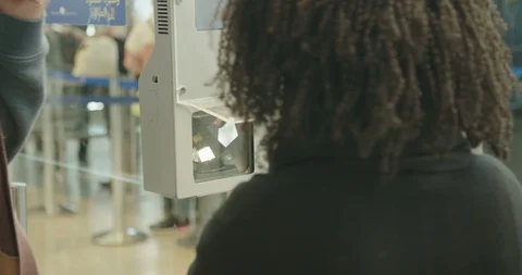 Security person checking passenger passports at the airport Stock Footage 86123337
