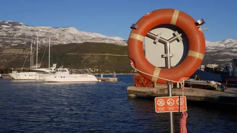 Security post with lifebuoy and rope on the pier Stock Footage 165145484