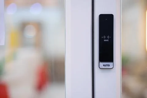 A security scanner controls access to the condominium's door Stock Photos