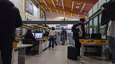 Security screening checkpoint with passengers at Jordan international airport Stock Footage 343960313