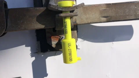 Security Seal Attached To Cargo Shipping Trailer For Anti-Theft Protection Stock Footage 265904544