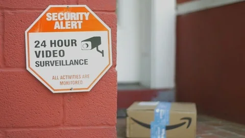 Security Sign and Amazon Box Sitting on Front Porch after Delivery Stock Footage 113284841