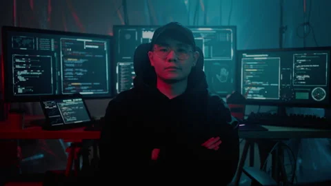 Security specialist with crossed arms working at dark room Stock Footage 257382754