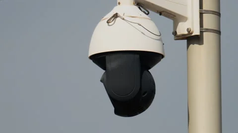 Security surveillance camera dome spinning outdoors monitoring area on pole. Stock Footage 339374195