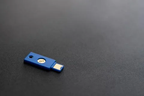 Security system concept. Key-shaped USB drive on dark background. Technology  Stock Photos