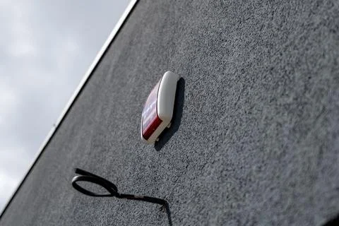 A security system is mounted on the wall of a house, showing the importance.. Stock Photos