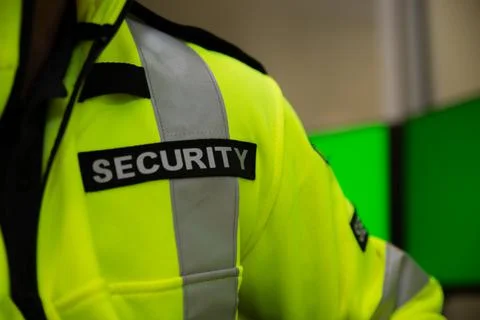 Security team watching over CCTV surveillance monitors. Stock Photos