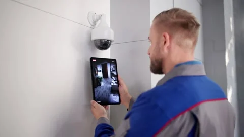 Security Technician Installing CCTV Surveillance System Stock Footage 321154669
