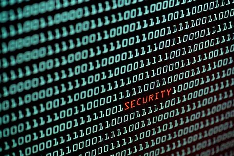 Security text and binary code concept from the desktop screen, selective f... Stock Photos