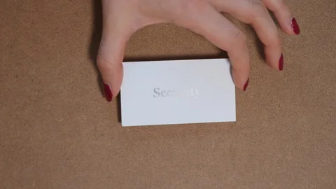SECURITY. Top shot - Hand puts paper card with word. CORE VALUE concept. Vidéo 124481166