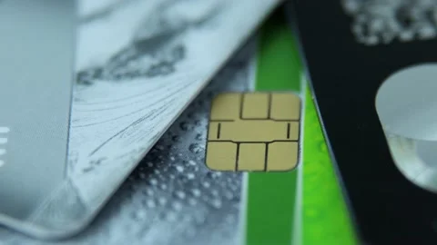 Security of using bank cards. Chip and wi-fi sign on the bank card close-up Stock Footage 170849986