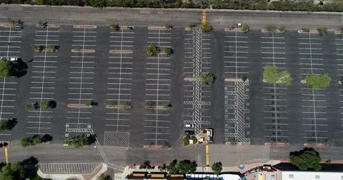 Security Vehicle Drives Empty Shopping Mall Parking Lot Road Covoid-19 Stock Footage 127809747