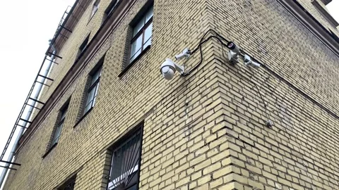 Security video camera moving to scan the area for surveillance purposes. Robotic Stock Footage 150001209