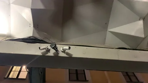 Security video camera moving to scan the area for surveillance purposes. Robotic Video stock 150001342