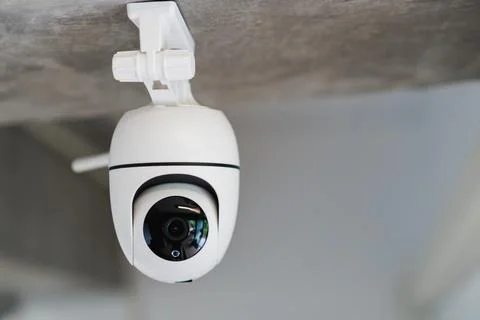 Security white CCTV (Closed-circuit television) camera in the office buildi.. Stock Photos