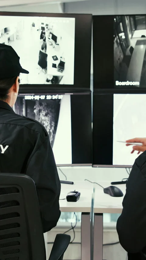 Security, woman and team with camera in control room, working late or Stock Footage 331848640