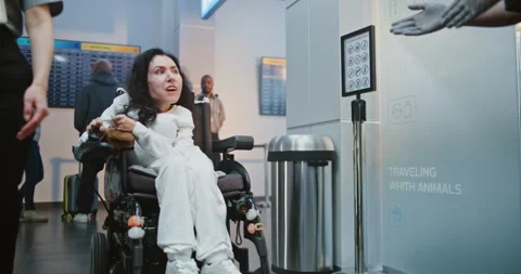 Security Worker Walks with Woman with Physical Disability to Security Checkpoint Stock Footage 307270809