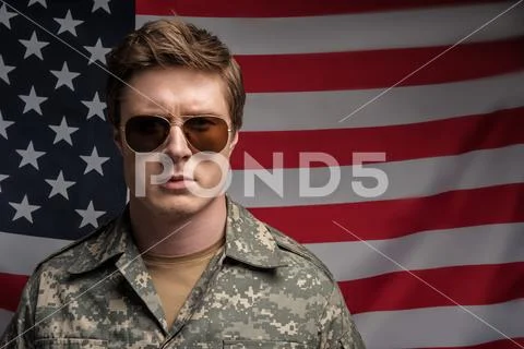 Sedate male soldier working in military service Stock Photos